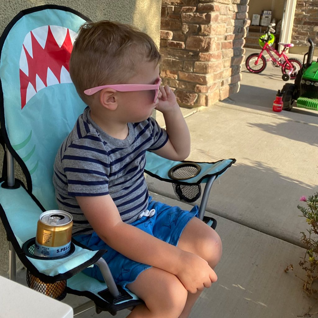 child in a shark chair