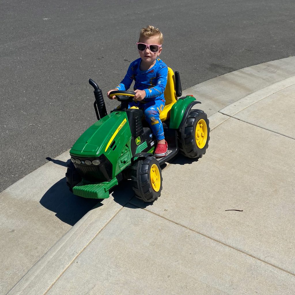 child driving a tractor